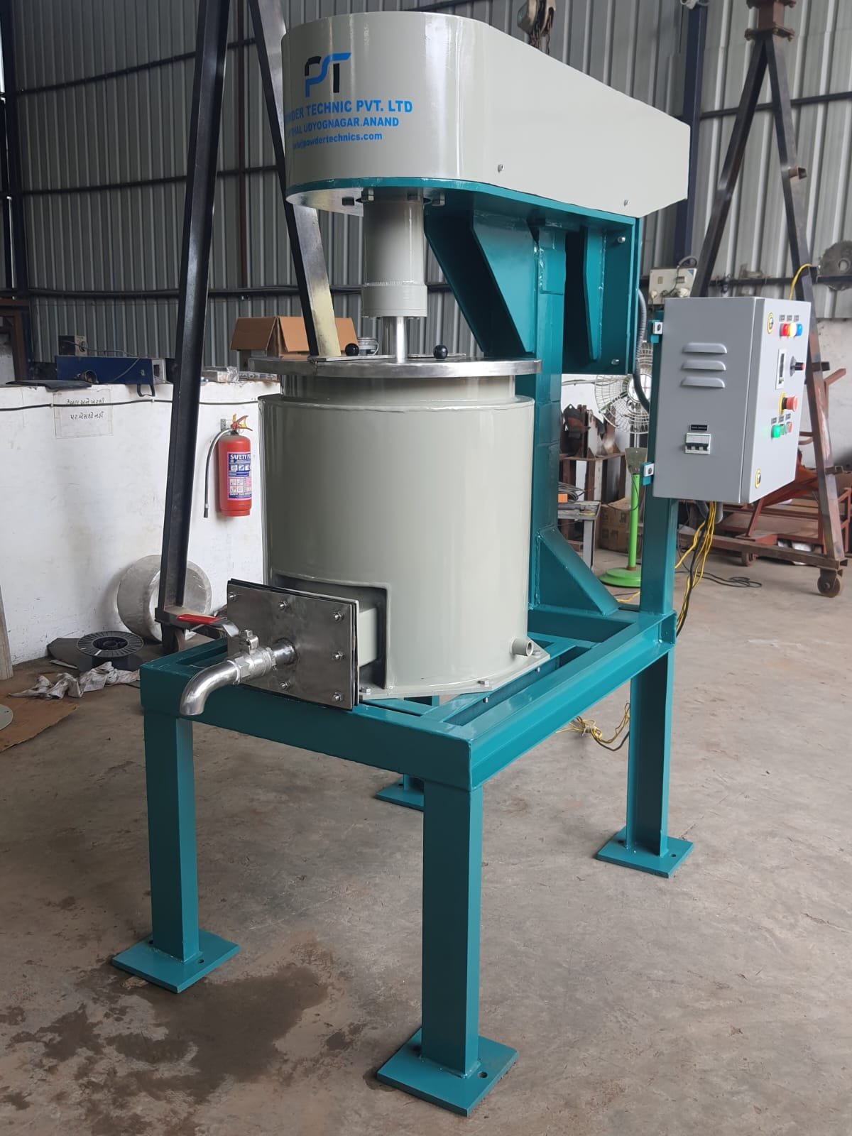 Vertical grinding bead mill with drive motor and control panel